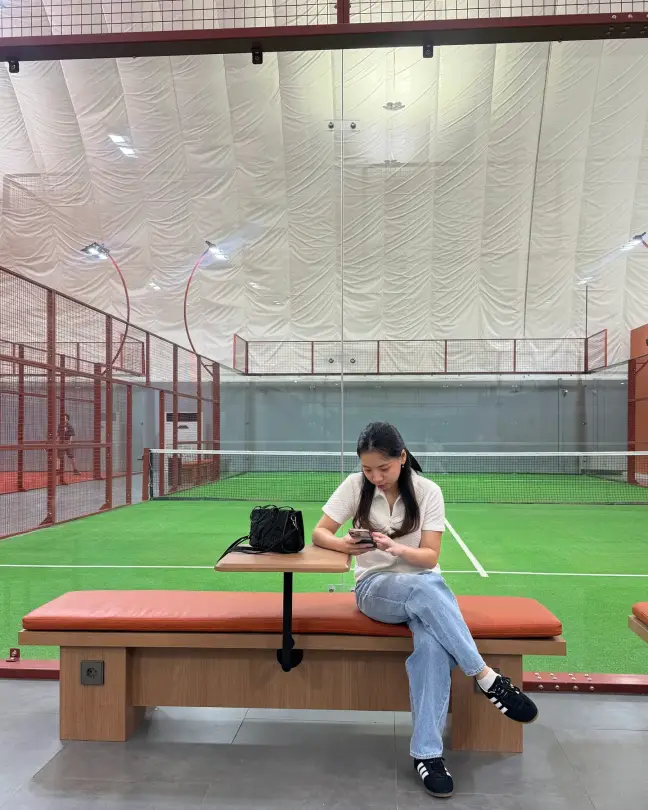 Courtside bench with a player resting