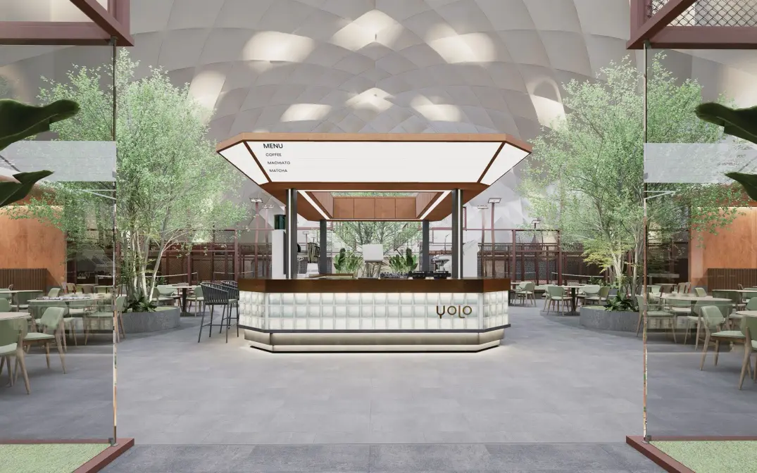 Glass-block café kiosk framed by trees